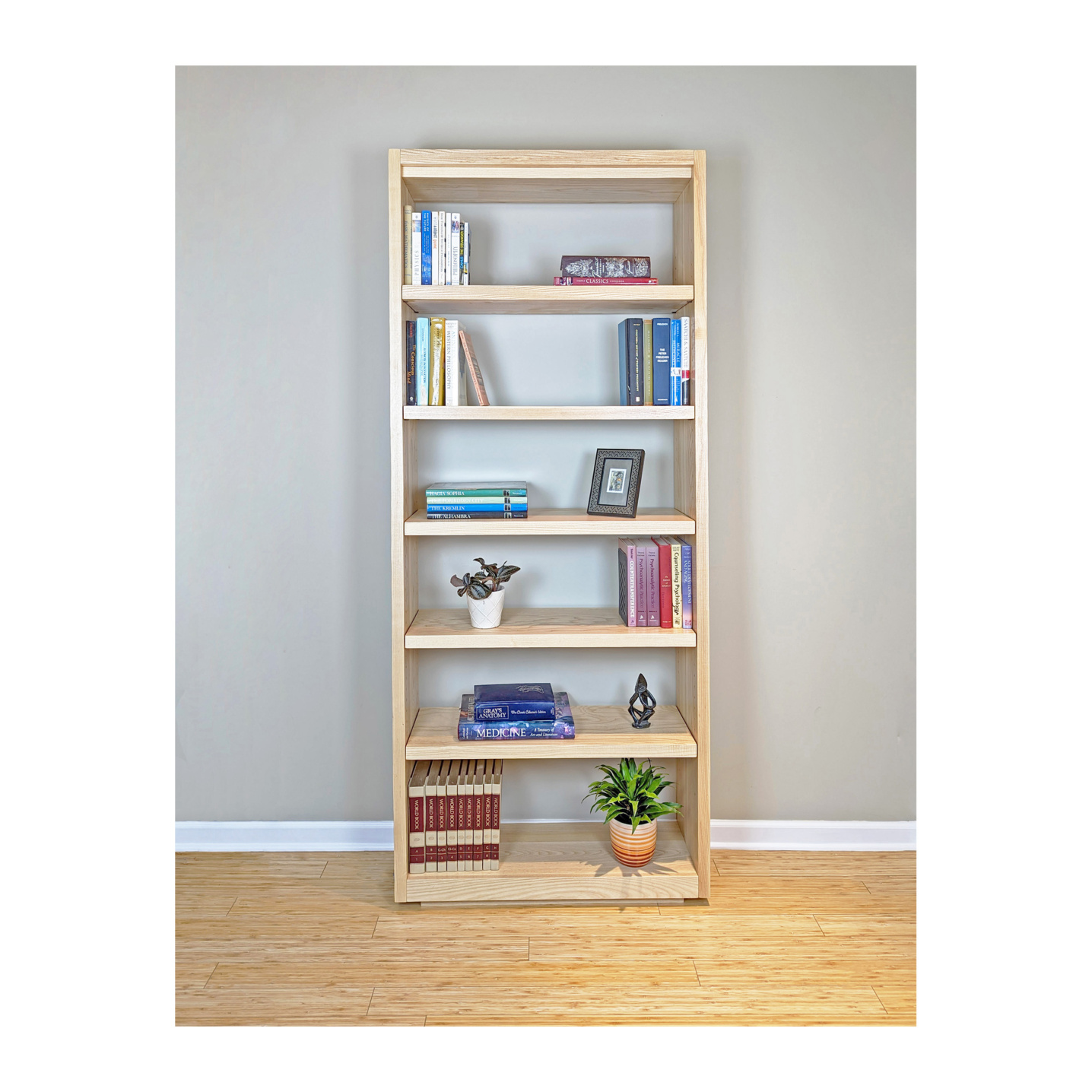Scandinavian bookcase with solid wood shelves This particular design is an open back bookcase--Made by 57NorthPlank Tailored Modern Furniture