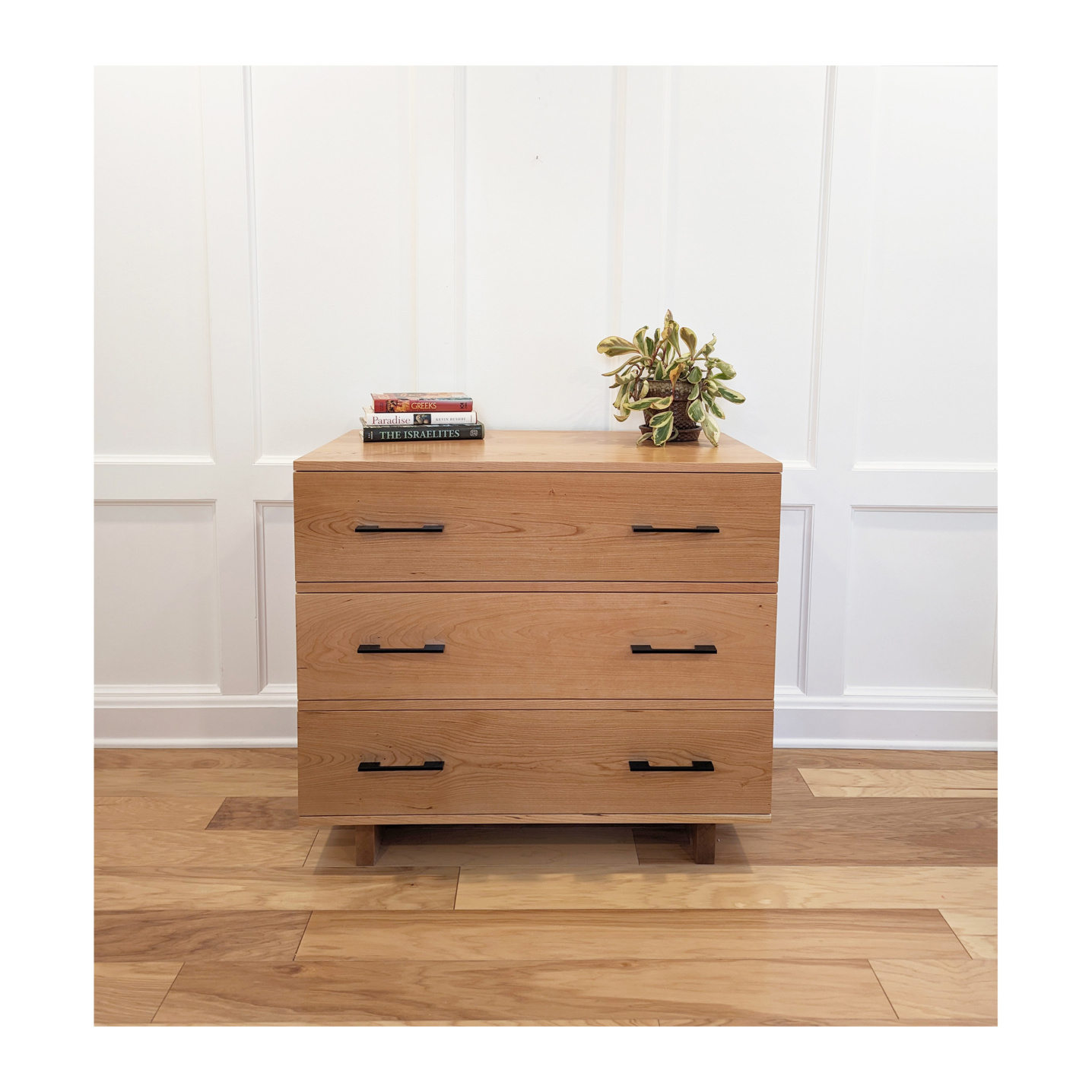 Three drawer handmade dresser with a simple style in cherry wood